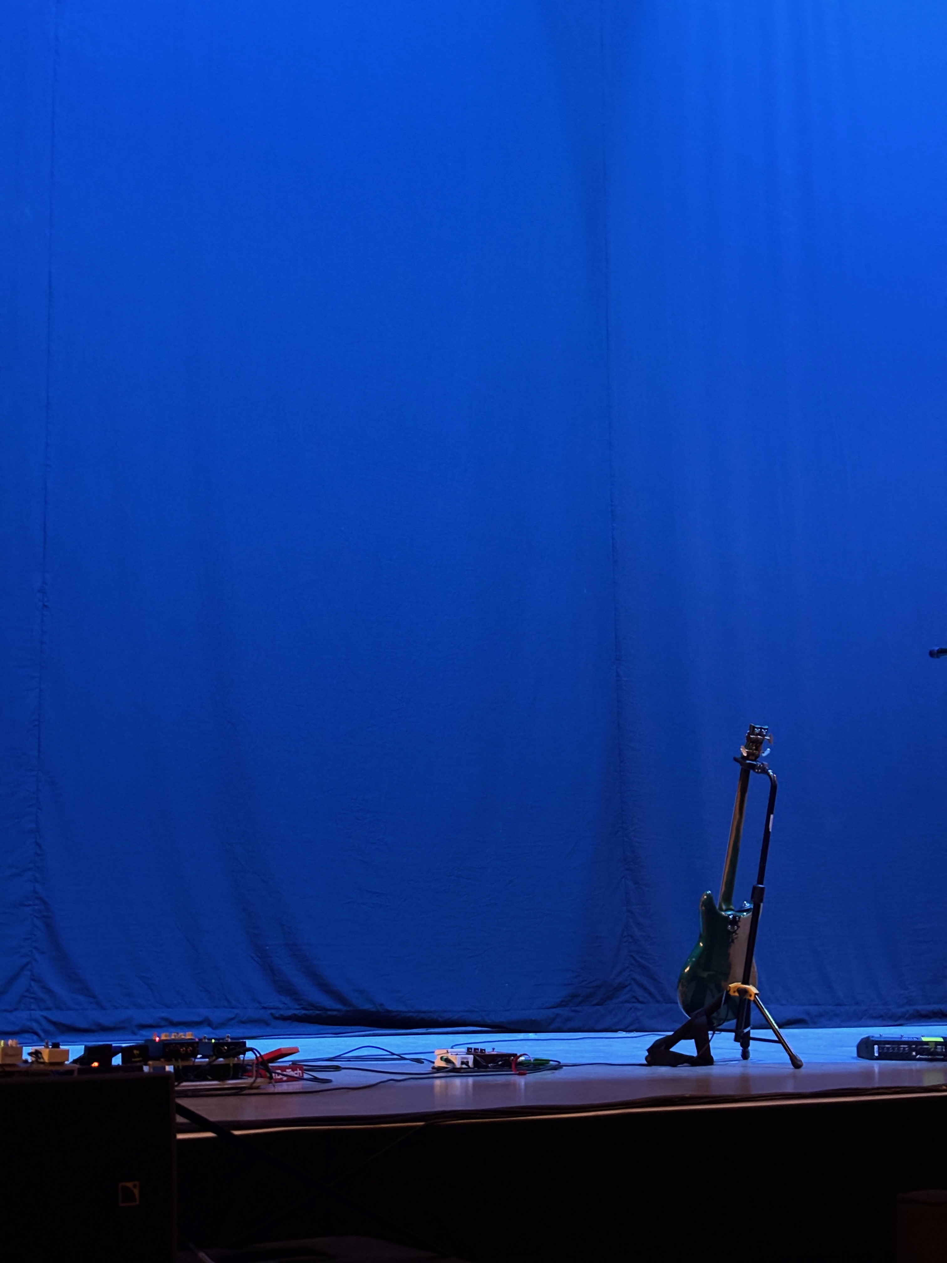 A bass guitar on stage before a rock concert